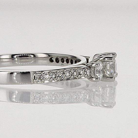 three stone ring, round diamond engagement ring side view